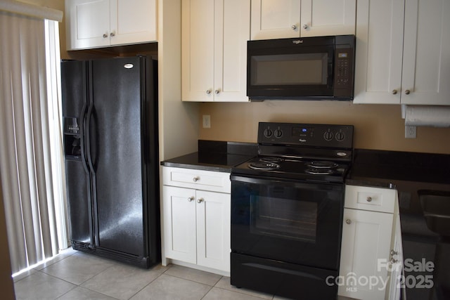 331 Eastwood Dr, Salisbury, NC 28146 - kitchen with dark countertops, light tile patterned floors, white cabinets, and black appliances