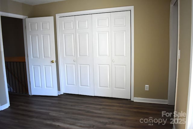 331 Eastwood Dr, Salisbury, NC 28146 - unfurnished bedroom with dark wood-type flooring, a closet, and baseboards