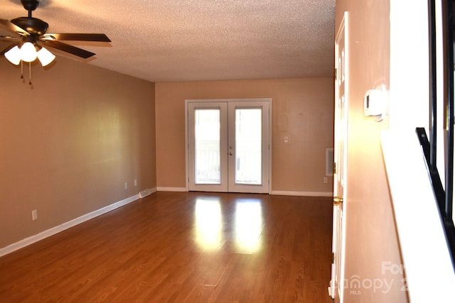 331 Eastwood Dr, Salisbury, NC 28146 - unfurnished room with french doors, baseboards, a ceiling fan, and dark wood finished floors
