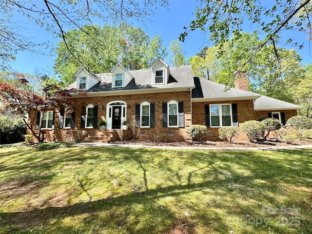 271 Ikerd Dr SE, Concord, NC 28025 - cape cod-style house with roof with shingles, brick siding, a chimney, and a front lawn
