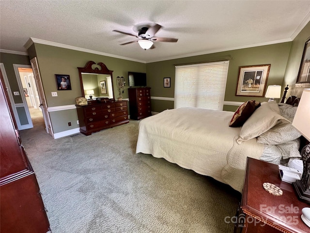 271 Ikerd Dr SE, Concord, NC 28025 - bedroom with baseboards, a textured ceiling, crown molding, ceiling fan, and carpet
