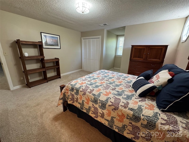 271 Ikerd Dr SE, Concord, NC 28025 - bedroom with a closet, baseboards, a textured ceiling, visible vents, and light colored carpet