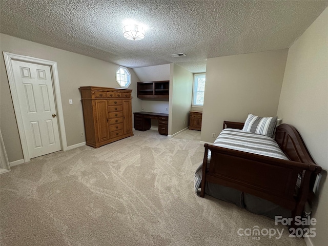 271 Ikerd Dr SE, Concord, NC 28025 - bedroom with a textured ceiling, light colored carpet, multiple windows, and visible vents