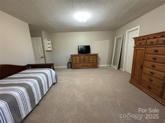 271 Ikerd Dr SE, Concord, NC 28025 - bedroom with light carpet, a textured ceiling, and baseboards