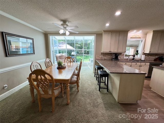 271 Ikerd Dr SE, Concord, NC 28025 - dining space with crown molding, a ceiling fan, plenty of natural light, and a textured ceiling