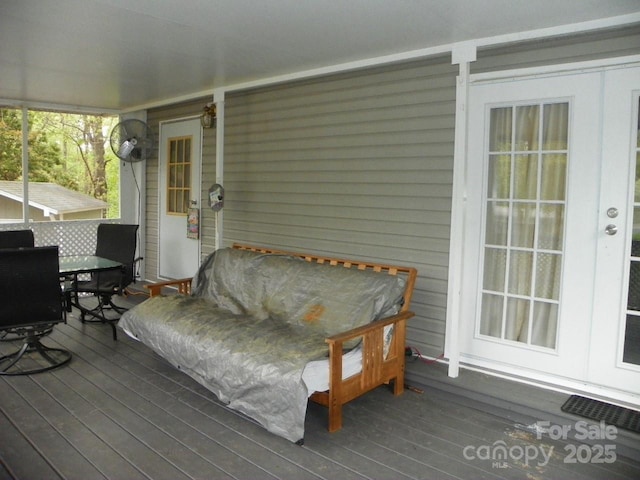 deck with french doors, visible vents, and outdoor dining space
