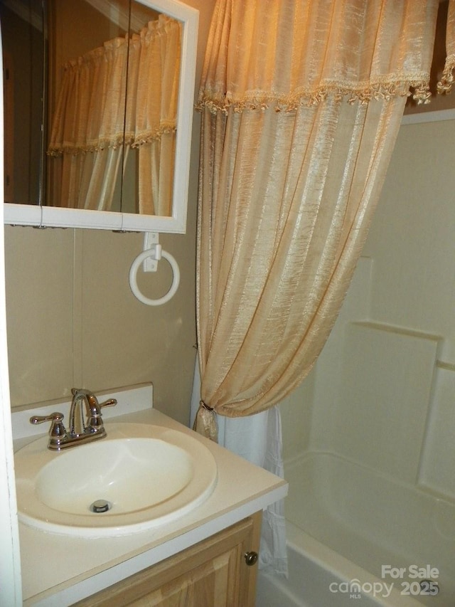 full bathroom featuring shower / bath combo and vanity