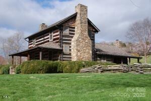 16 Ridgeview Dr, Asheville, NC 28804 - view of side of home with a lawn and a chimney