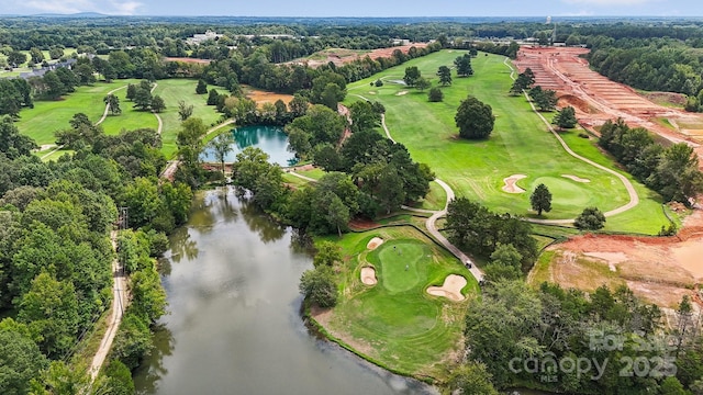 bird's eye view with a water view and view of golf course