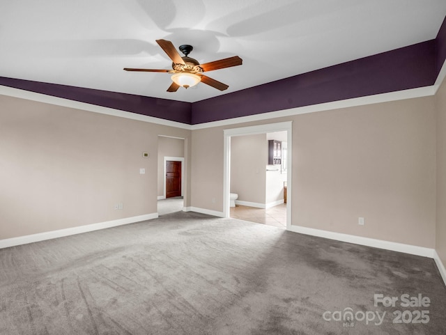 unfurnished room featuring ceiling fan, carpet floors, and baseboards