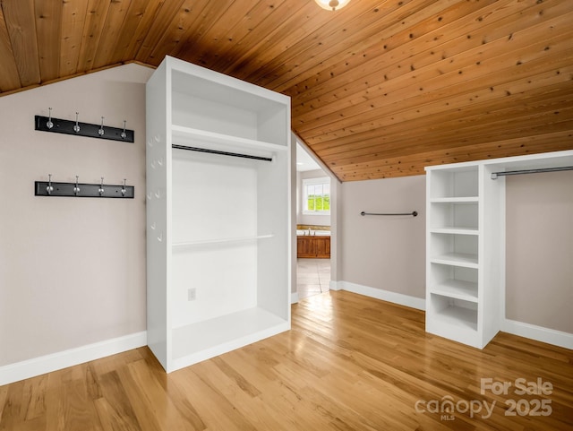 interior space featuring wooden ceiling, vaulted ceiling, and wood finished floors