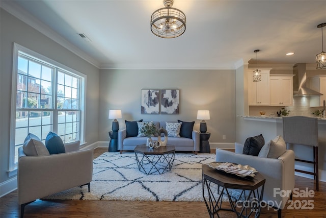 439 Beacon St NW, Concord, NC 28027 - living area featuring baseboards, ornamental molding, and visible vents