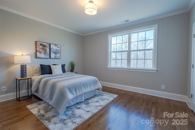 439 Beacon St NW, Concord, NC 28027 - bedroom with visible vents, baseboards, ornamental molding, and wood finished floors