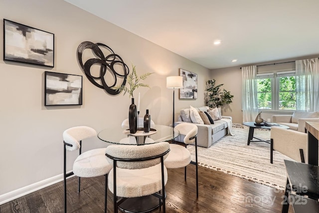 dining area featuring recessed lighting, wood finished floors, and baseboards