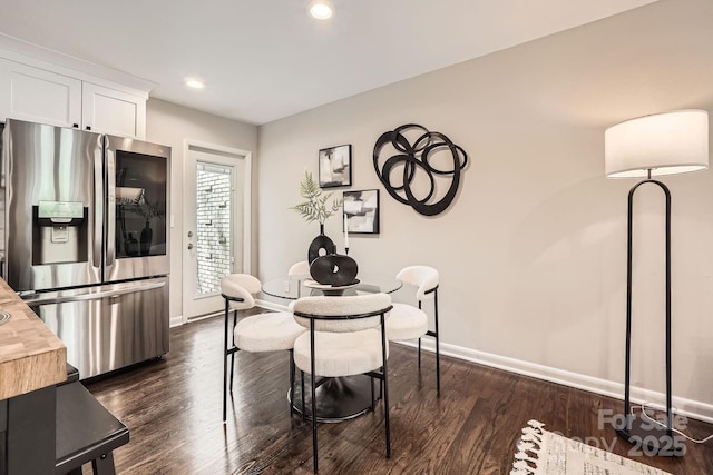 dining area featuring baseboards, dark wood-type flooring, and recessed lighting