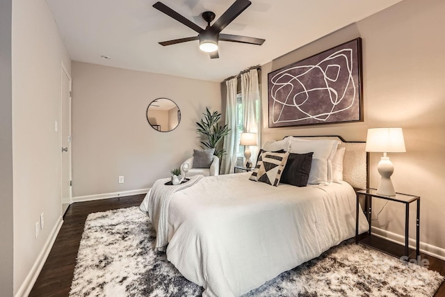 bedroom with baseboards, wood finished floors, and ceiling fan