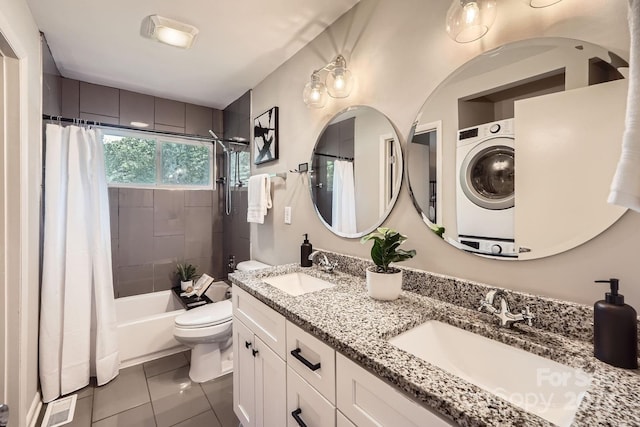 full bathroom with shower / bath combo with shower curtain, tile patterned flooring, toilet, and a sink