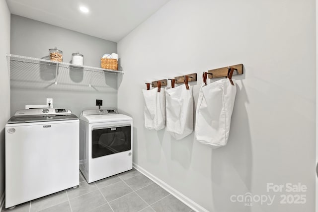clothes washing area featuring baseboards, recessed lighting, light tile patterned floors, washer and clothes dryer, and laundry area