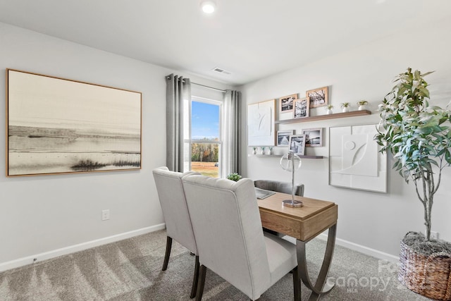 office space featuring visible vents, baseboards, and carpet