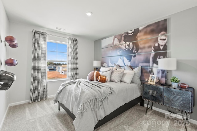 bedroom featuring baseboards, visible vents, and carpet floors