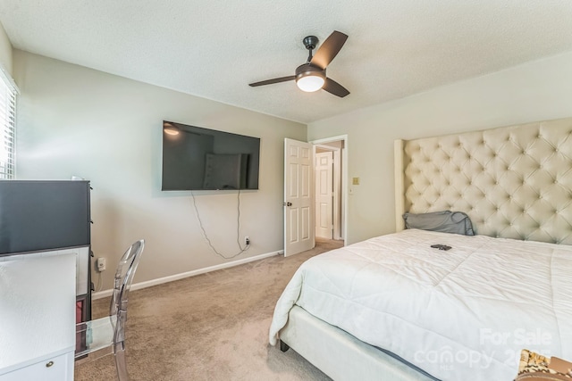 bedroom with carpet flooring, baseboards, and ceiling fan
