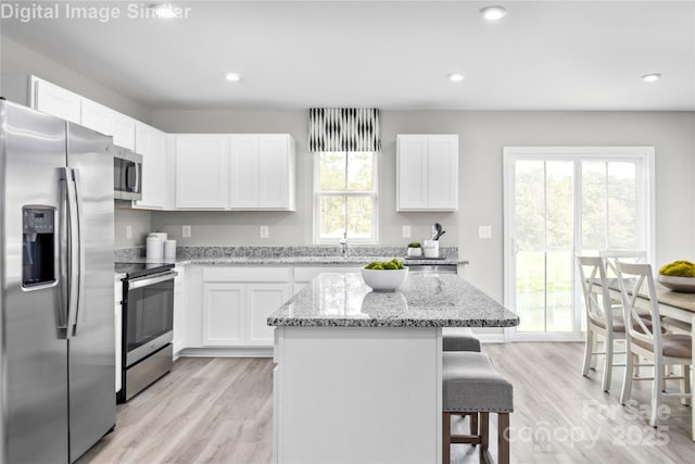 1521 39th Avenue Loop NE Unit 3, Hickory, NC 28601 - kitchen with appliances with stainless steel finishes, a breakfast bar area, a center island, white cabinets, and recessed lighting