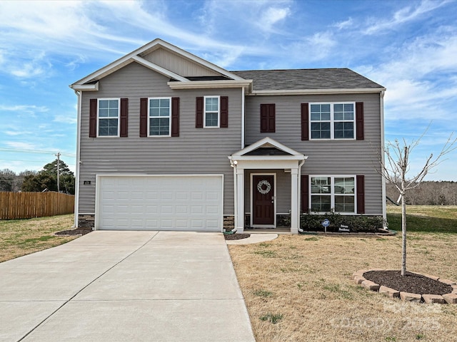 479 Daniel Dr, Lexington, NC 27295 - view of front facade featuring an attached garage, fence, stone siding, and driveway