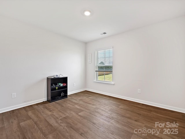 479 Daniel Dr, Lexington, NC 27295 - spare room featuring dark wood-type flooring, baseboards, and visible vents