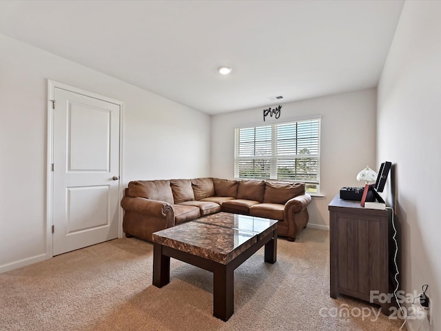 479 Daniel Dr, Lexington, NC 27295 - living room featuring visible vents, baseboards, and light carpet