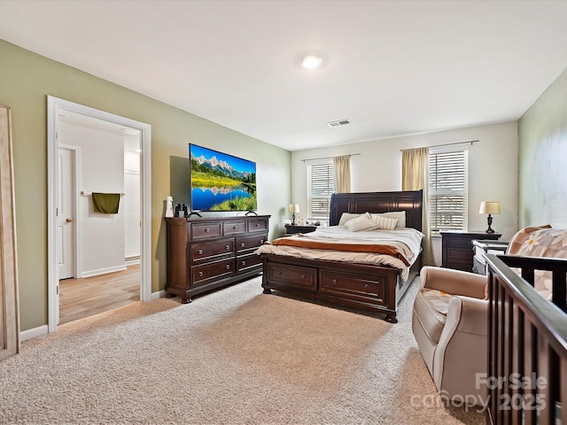 479 Daniel Dr, Lexington, NC 27295 - bedroom with visible vents, baseboards, and light carpet