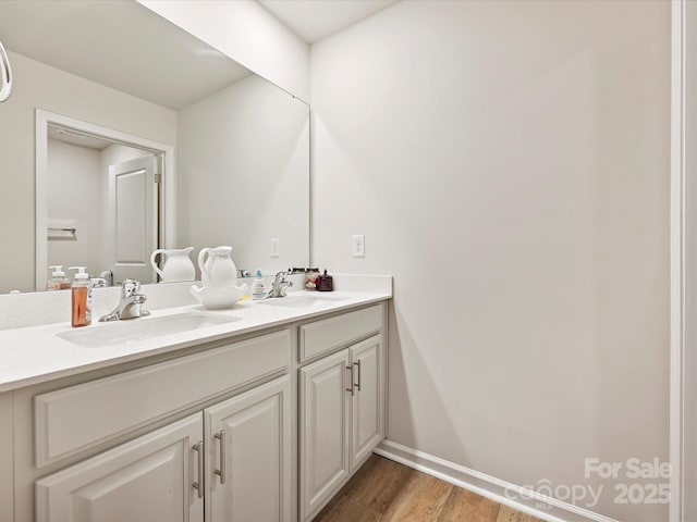 479 Daniel Dr, Lexington, NC 27295 - full bathroom with double vanity, baseboards, a sink, and wood finished floors