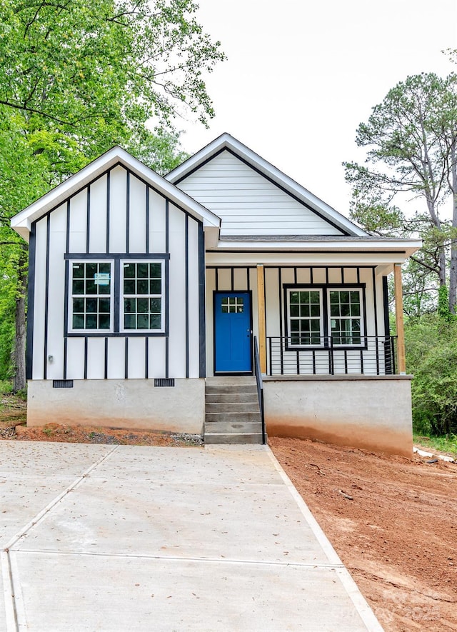 2350 14th Street Ct NE, Hickory, NC 28601 - view of front facade featuring board and batten siding, covered porch, and crawl space