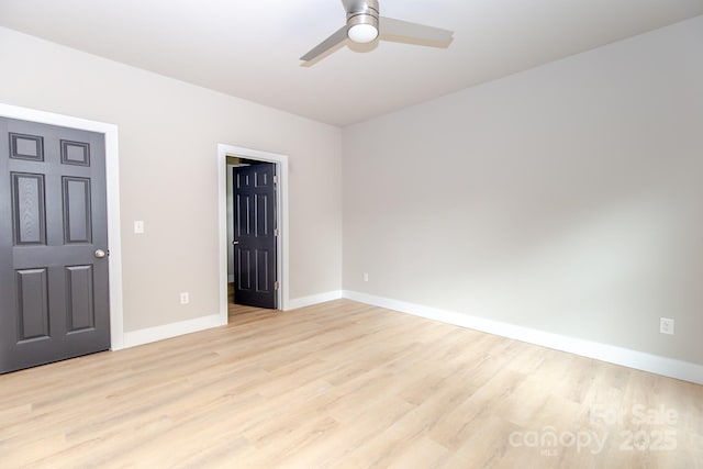 2350 14th Street Ct NE, Hickory, NC 28601 - unfurnished room with light wood-style floors, ceiling fan, and baseboards
