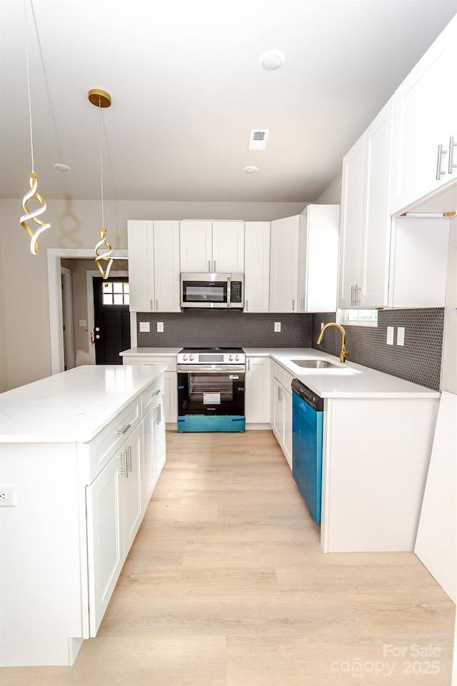 2350 14th Street Ct NE, Hickory, NC 28601 - kitchen with appliances with stainless steel finishes, white cabinetry, and decorative backsplash