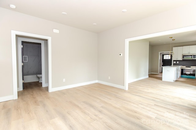2350 14th Street Ct NE, Hickory, NC 28601 - unfurnished living room with light wood-type flooring