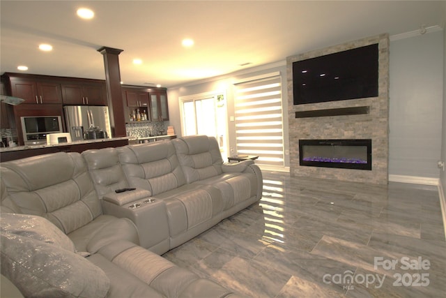 7428 Beaufort Cir, Charlotte, NC 28227 - living room with baseboards, ornamental molding, recessed lighting, a fireplace, and decorative columns