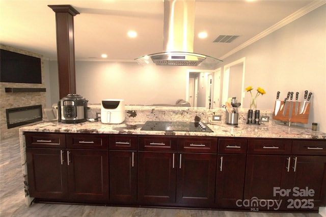 7428 Beaufort Cir, Charlotte, NC 28227 - interior space with ornamental molding, visible vents, light stone counters, island exhaust hood, and black electric stovetop