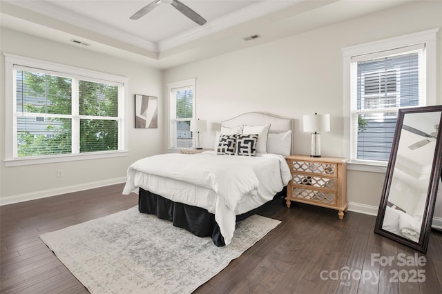 bedroom with crown molding, dark wood-type flooring, baseboards, and a ceiling fan