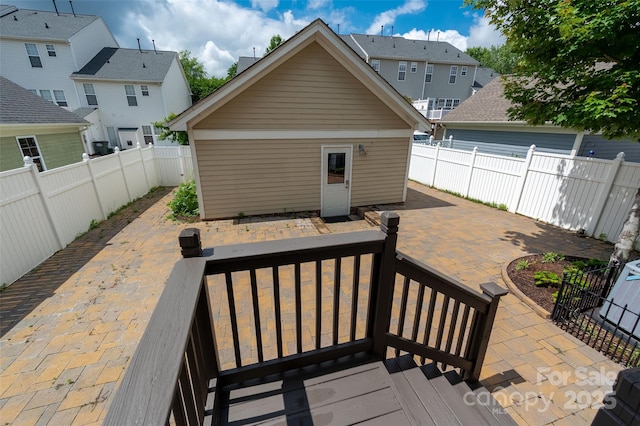 deck featuring a fenced backyard, a patio area, and a residential view