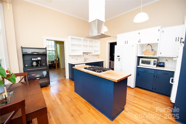 447 N Washington St, Rutherfordton, NC 28139 - kitchen with blue cabinetry, open shelves, white appliances, and wood counters