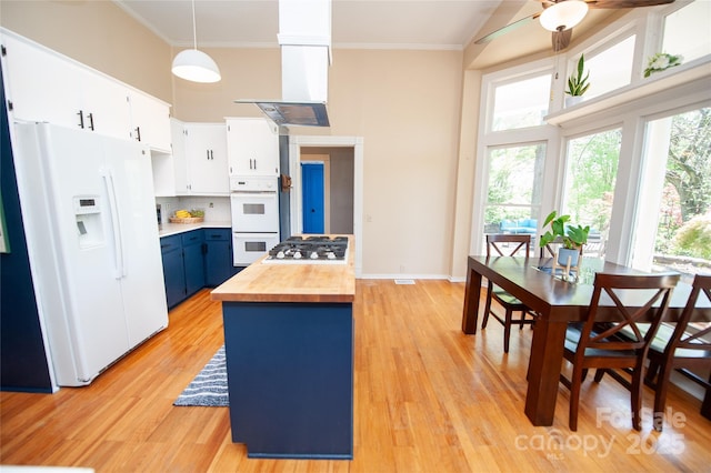 447 N Washington St, Rutherfordton, NC 28139 - kitchen featuring ornamental molding, white appliances, blue cabinetry, butcher block counters, and ceiling fan