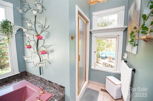 447 N Washington St, Rutherfordton, NC 28139 - full bathroom featuring tile patterned flooring, a garden tub, and a stall shower