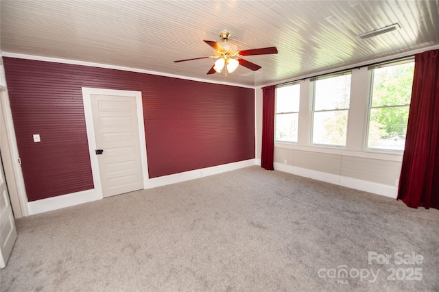 447 N Washington St, Rutherfordton, NC 28139 - empty room featuring baseboards, carpet flooring, a ceiling fan, crown molding, and visible vents