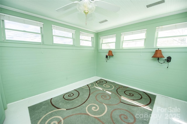 447 N Washington St, Rutherfordton, NC 28139 - interior space with a ceiling fan, baseboards, ornamental molding, and visible vents