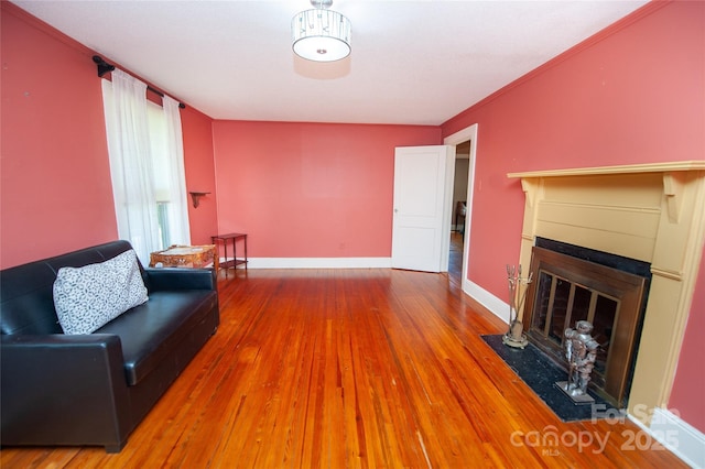 447 N Washington St, Rutherfordton, NC 28139 - living area with a fireplace with flush hearth, wood finished floors, and baseboards