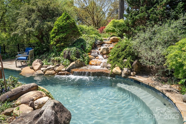 447 N Washington St, Rutherfordton, NC 28139 - view of pool featuring fence