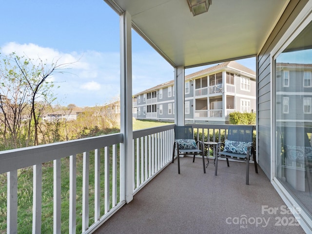 balcony featuring a residential view