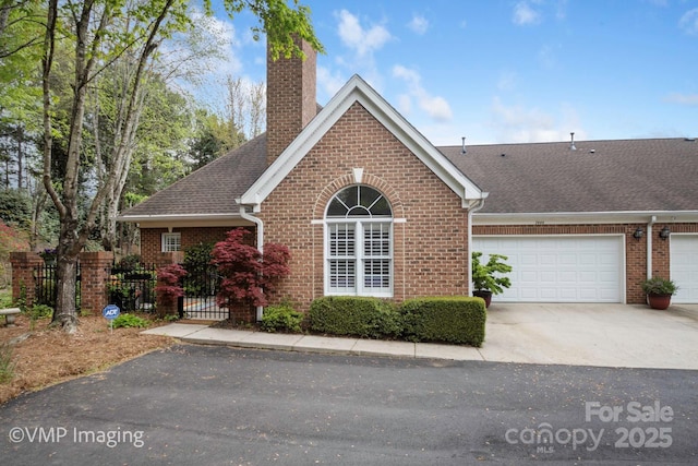 7444 Hurstbourne Green Dr, Charlotte, NC 28277 - ranch-style home with a garage, fence, brick siding, a chimney, and driveway