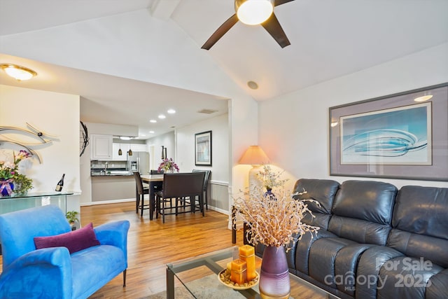 7444 Hurstbourne Green Dr, Charlotte, NC 28277 - living area with light wood-style floors, lofted ceiling with beams, a ceiling fan, recessed lighting, and baseboards