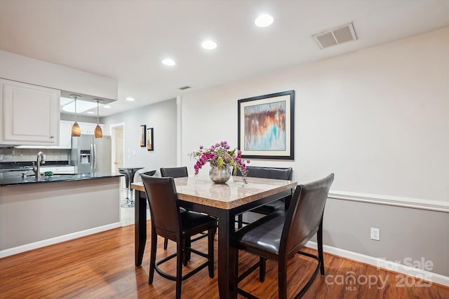 7444 Hurstbourne Green Dr, Charlotte, NC 28277 - dining space with visible vents, baseboards, recessed lighting, and wood finished floors